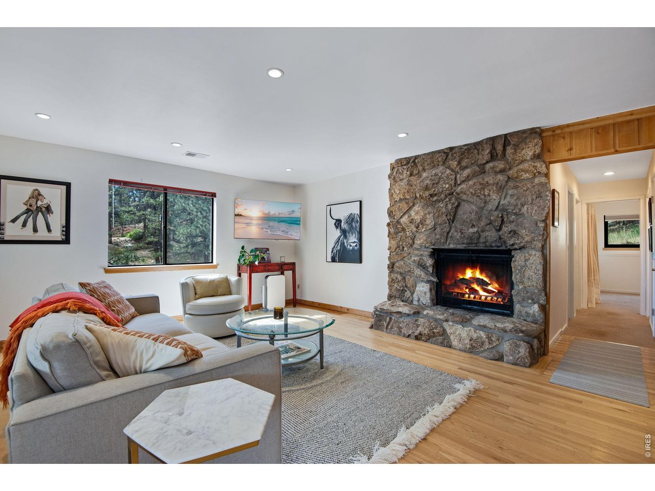 8394 Larkspur Road Boulder, CO 80302 - Photo 27 of 34 Lower level family room with moss rock fireplace