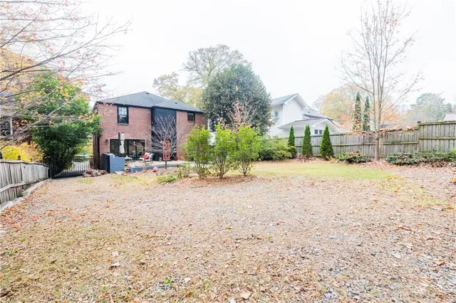 a kitchen with stainless steel appliances granite countertop a sink and a large window