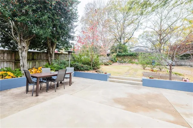 a living room with furniture cabinets and book shelf