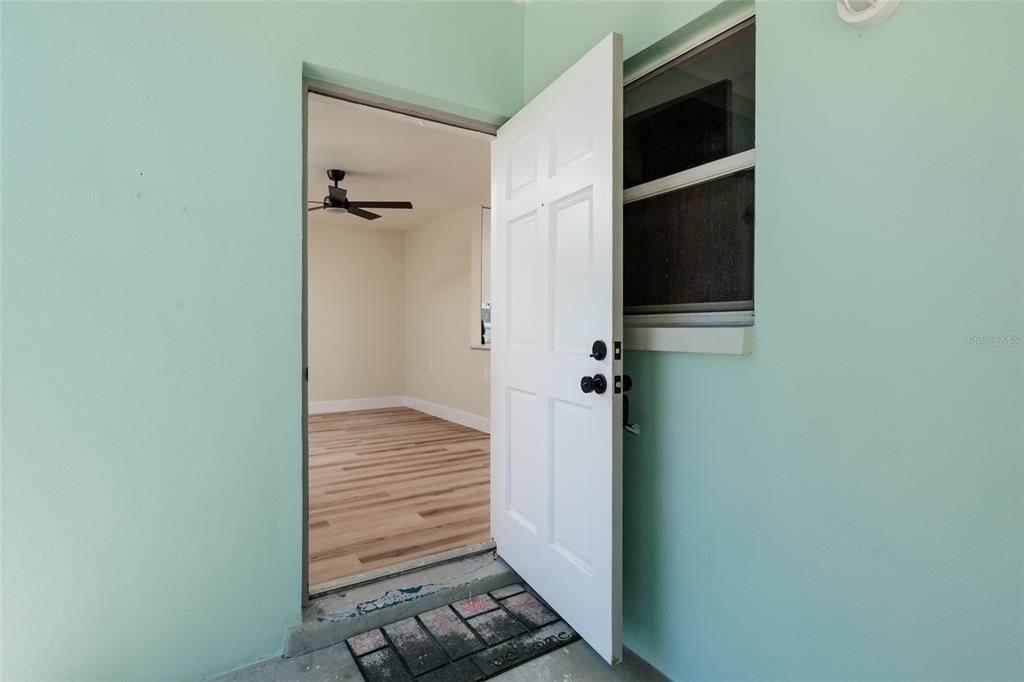 10 164th Avenue, Unit 1 Redington Beach, FL 33708 - Photo 11 of 38 a view of a hallway