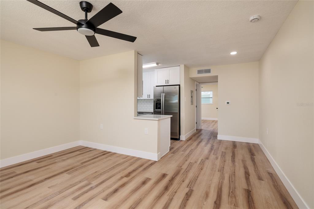 10 164th Avenue, Unit 1 Redington Beach, FL 33708 - Photo 14 of 38 a view of a kitchen with a sink and a refrigerator