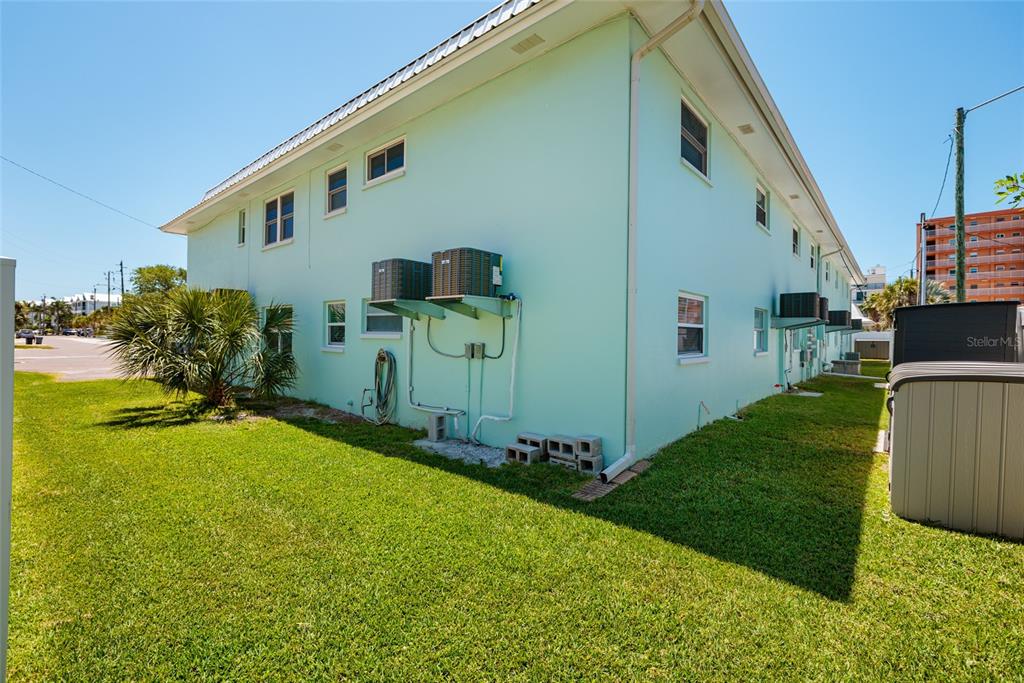 10 164th Avenue, Unit 1 Redington Beach, FL 33708 - Photo 27 of 38 a front view of a house with garden