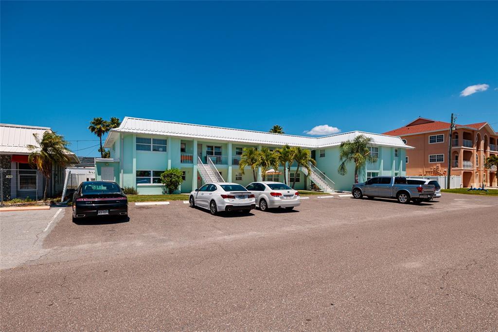 10 164th Avenue, Unit 1 Redington Beach, FL 33708 - Photo 28 of 38 a view of a car parked in front of a house