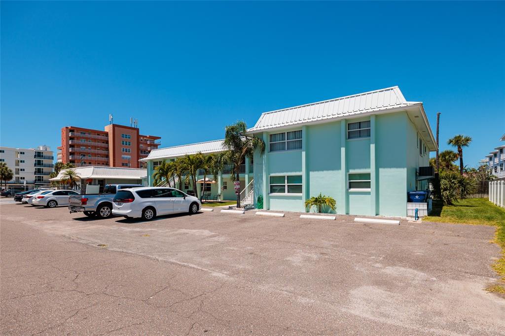 10 164th Avenue, Unit 1 Redington Beach, FL 33708 - Photo 29 of 38 a view of a car parked in front of a building