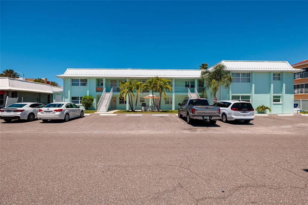 10 164th Avenue, Unit 1 Redington Beach, FL 33708 - Photo 5 of 38 a car parked in front of a house