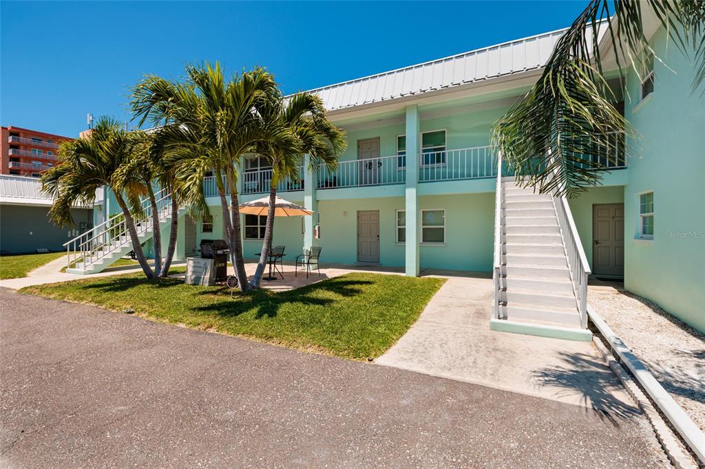 10 164th Avenue, Unit 1 Redington Beach, FL 33708 - Photo 10 of 38 a view of a house with backyard and swimming pool
