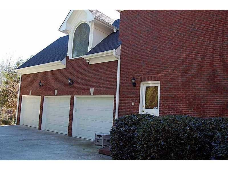 2728 Chieftain Run Duluth, GA 30097 - Photo 17 of 17 a view of a brick house with a door
