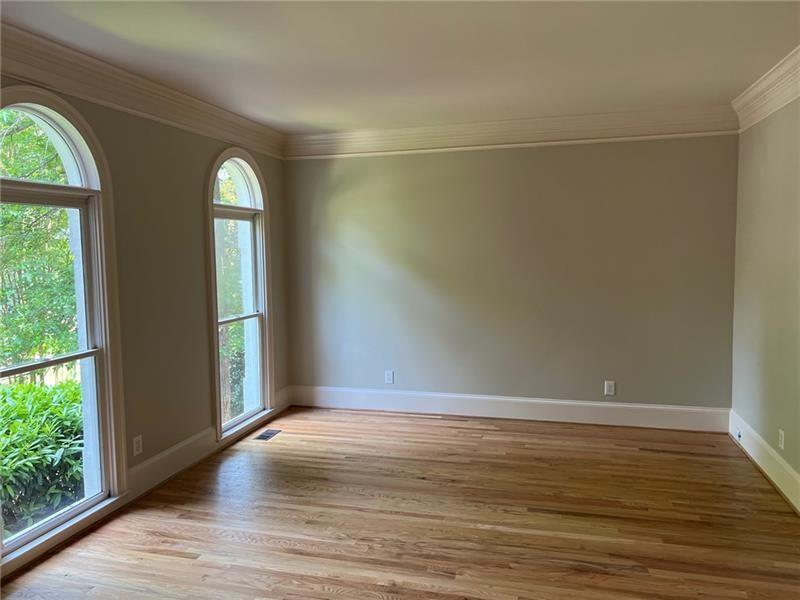 2728 Chieftain Run Duluth, GA 30097 - Photo 3 of 17 a view of empty room with wooden floor and fan