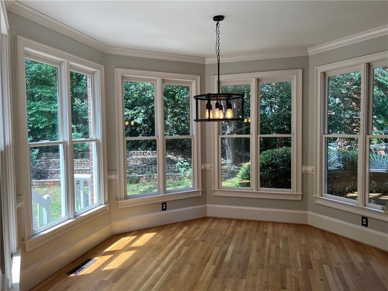 2728 Chieftain Run Duluth, GA 30097 - Photo 9 of 17 a view of an empty room with a window and wooden floor