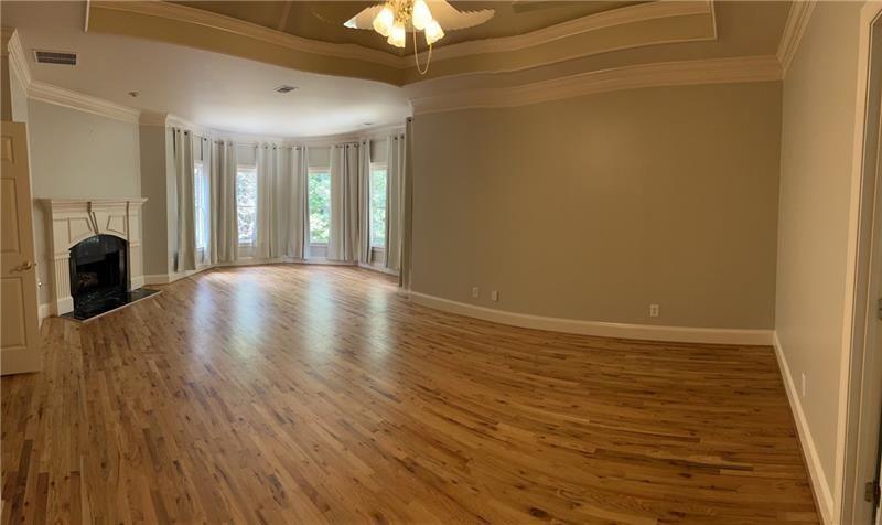 2728 Chieftain Run Duluth, GA 30097 - Photo 10 of 17 a view of an empty room with wooden floor and a window