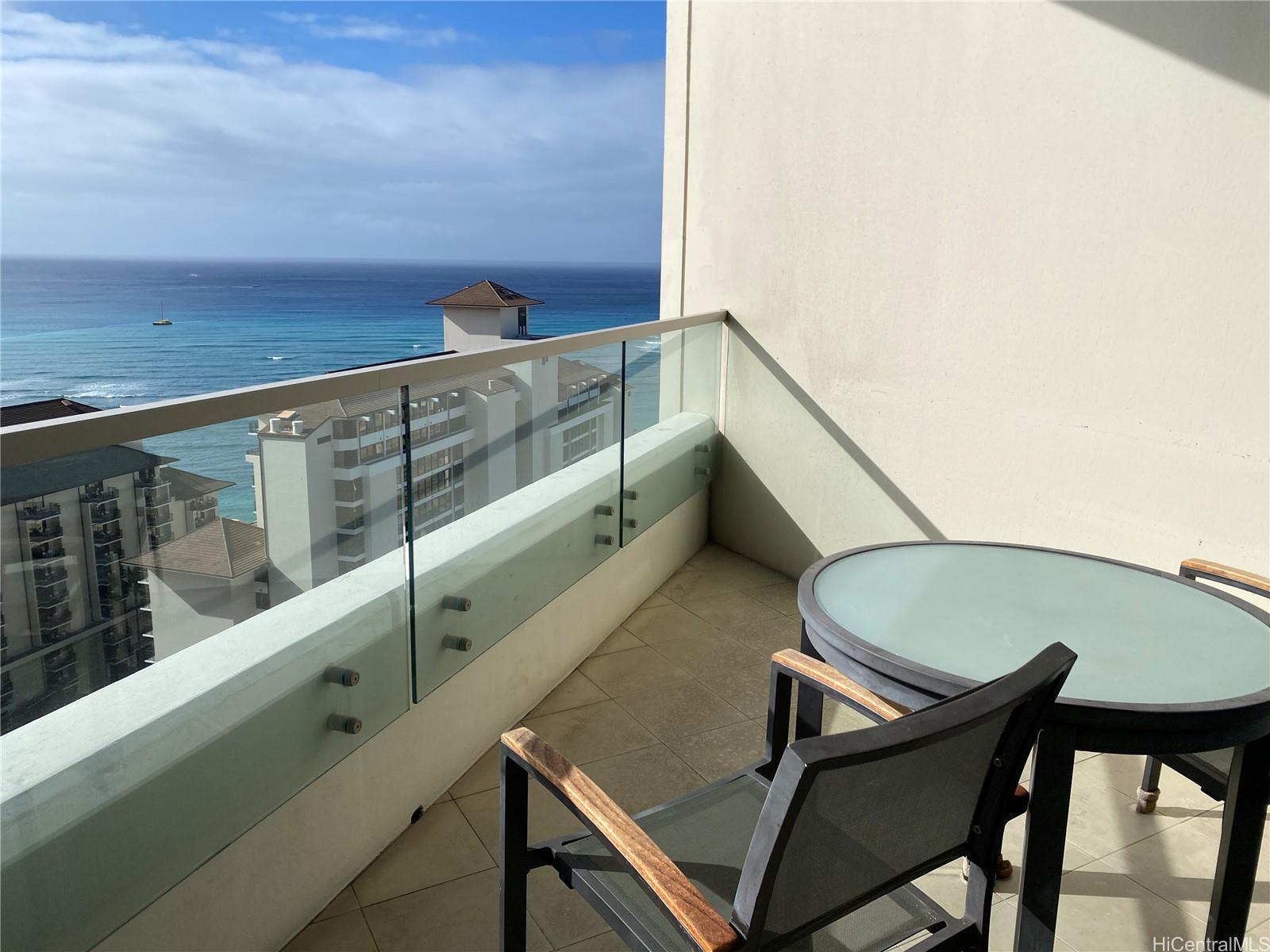 223 Saratoga Road, Unit 2316 Honolulu, HI 96815 - Photo 18 of 20 a view of balcony with two chairs and a table