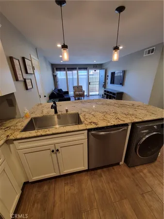 a kitchen with sink and window