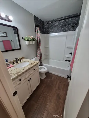 a view of a livingroom from a hallway