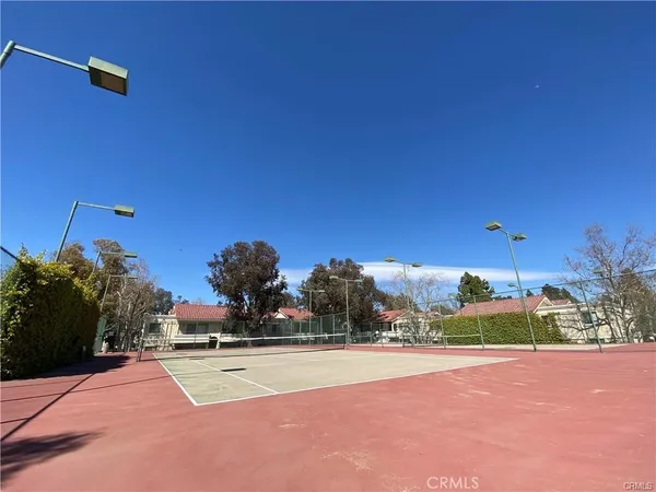 a view of a porch with furniture and a yard