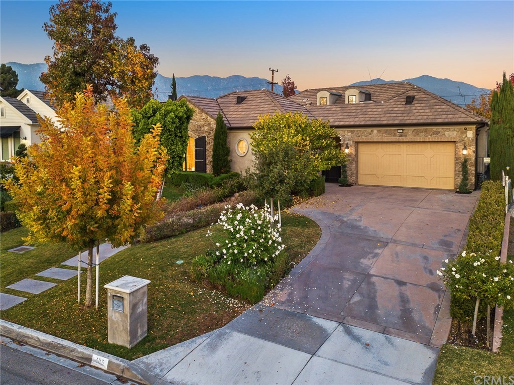 406 Drake Road Arcadia, CA 91007 - Photo 6 of 8 a front view of a house with a yard and fountain