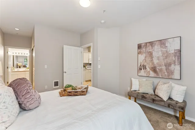 a bedroom with a bed and couch