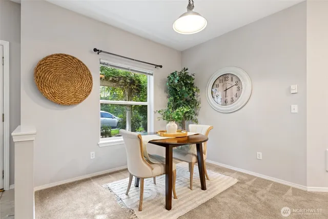 a view of a room with a table and a chair