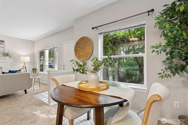 a view of a dining room with furniture window and outside view