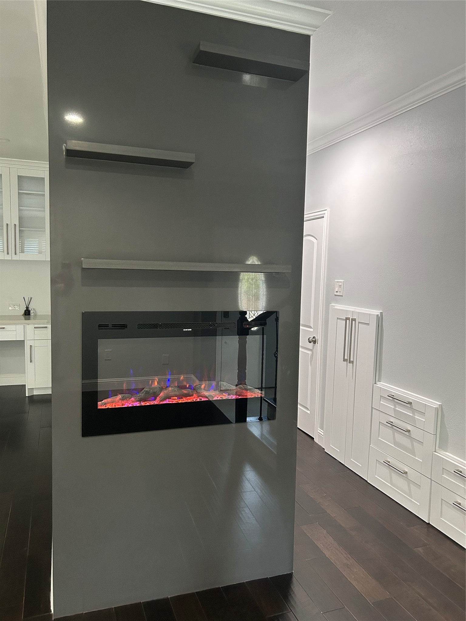 840 Threadneedle Street, Unit 220 Houston, TX 77079 - Photo 8 of 20 Includes a sleek built-in electric fireplace for cozy ambiance.