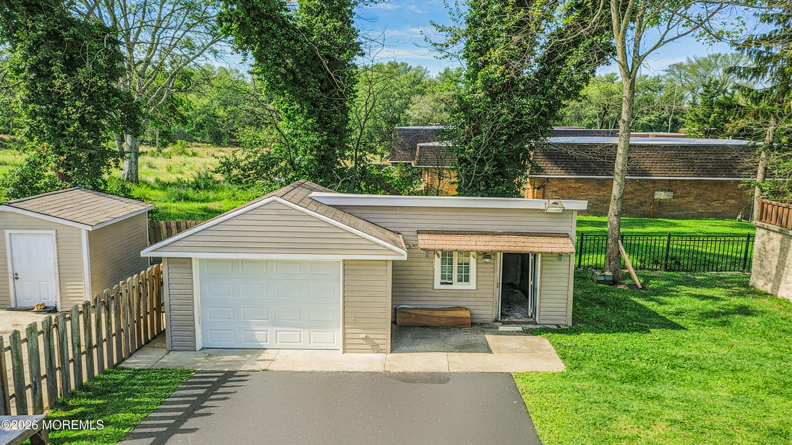 244 Overbrook Avenue Oakhurst, NJ 07755 - Photo 2 of 8 a front view of a house with a yard