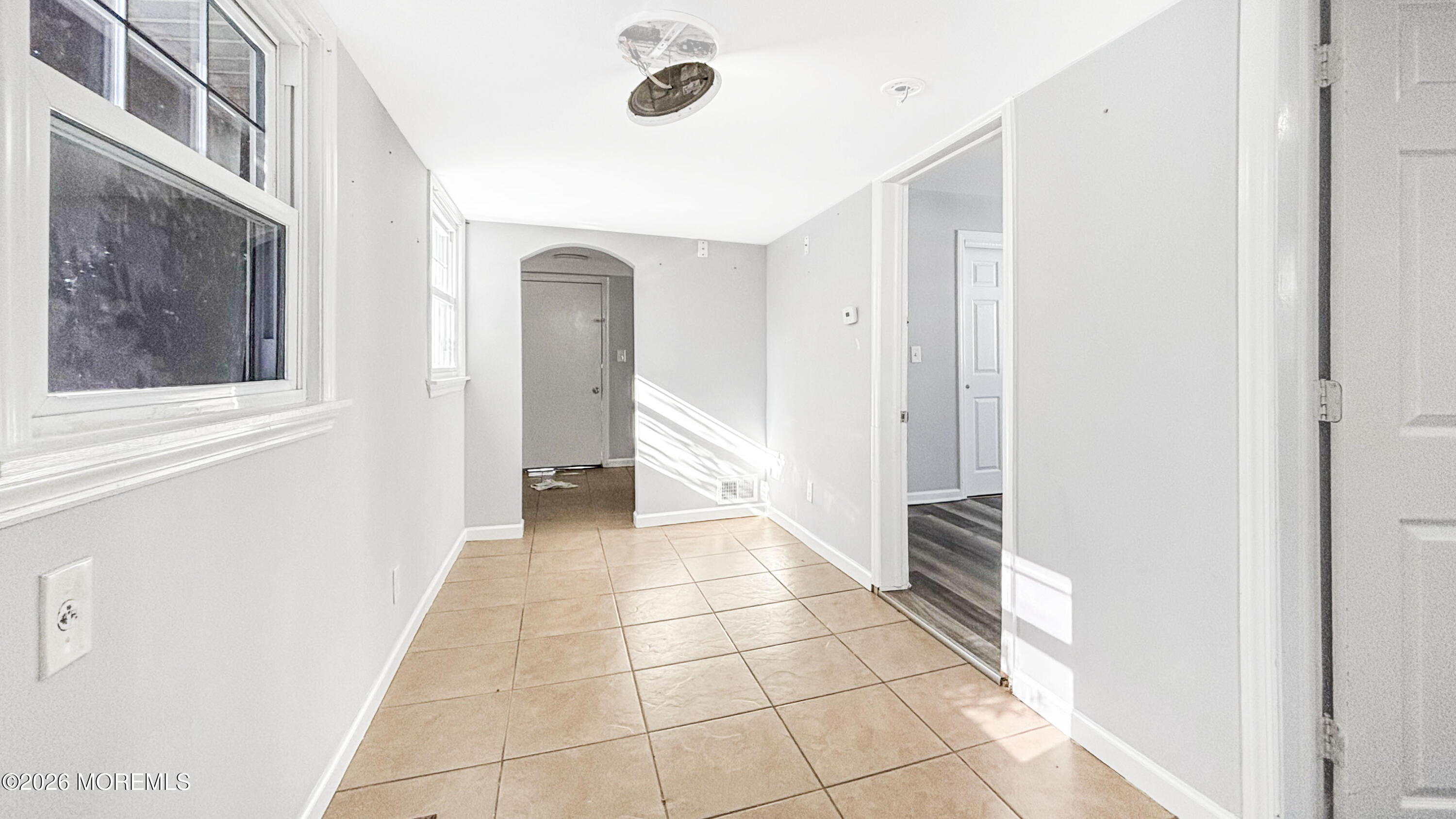 244 Overbrook Avenue Oakhurst, NJ 07755 - Photo 6 of 8 a view of a hallway to rooms and stairs