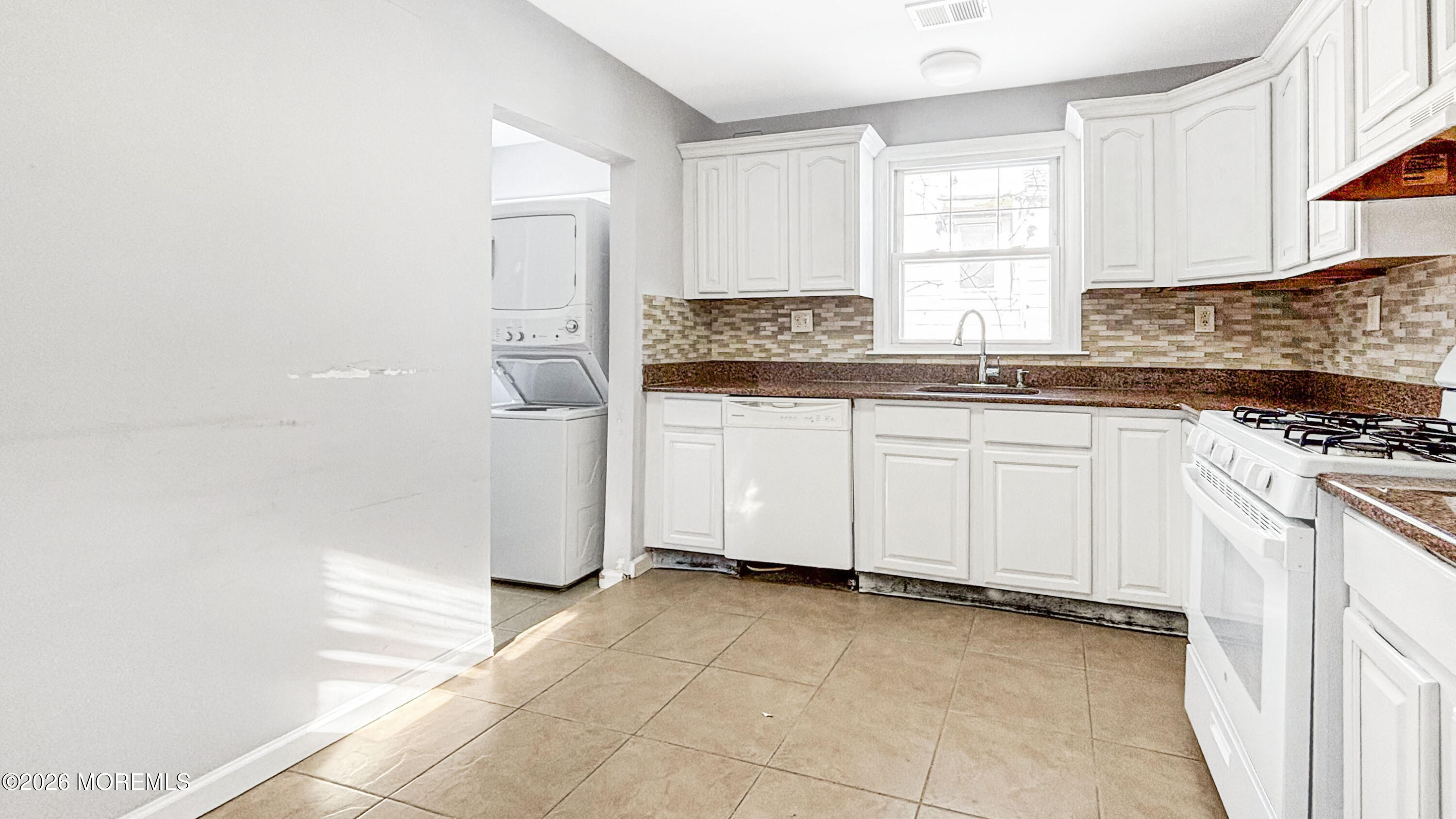 244 Overbrook Avenue Oakhurst, NJ 07755 - Photo 7 of 8 a kitchen with a stove a sink and a refrigerator