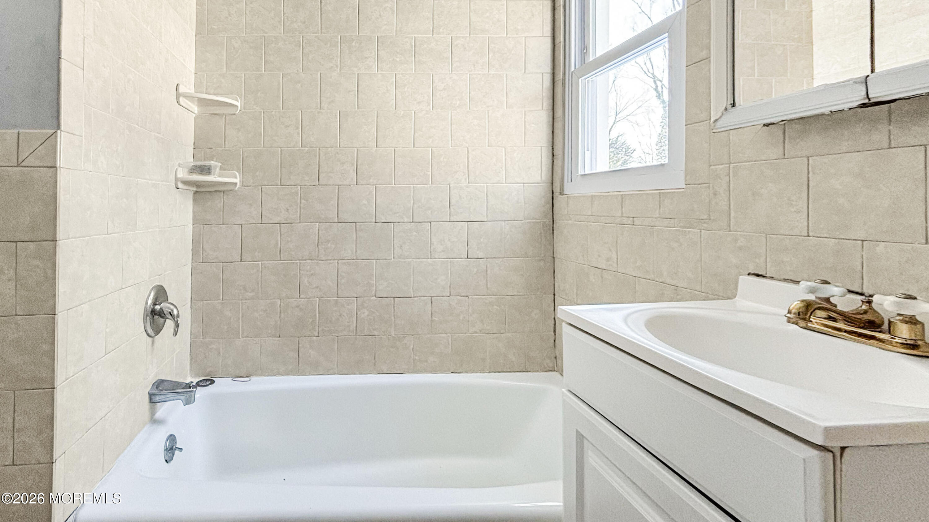 244 Overbrook Avenue Oakhurst, NJ 07755 - Photo 8 of 8 a bathroom with a sink and bathtub