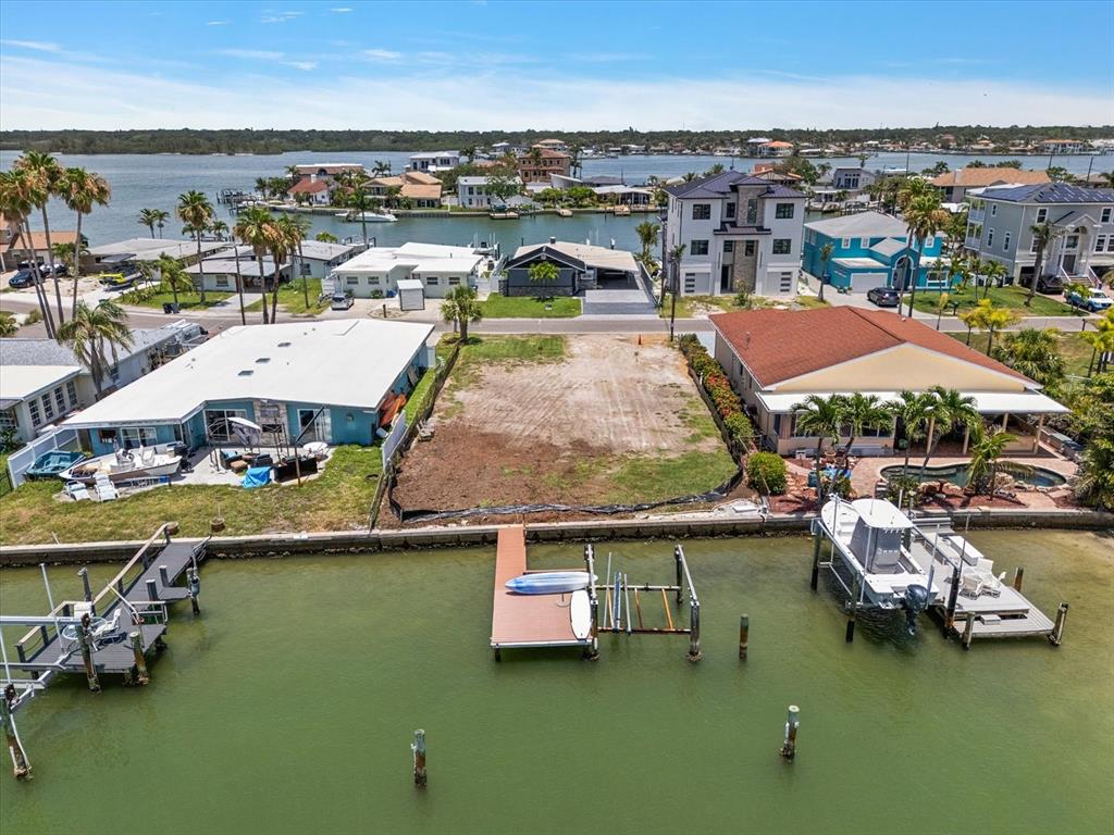a view of a lake with lawn chairs
