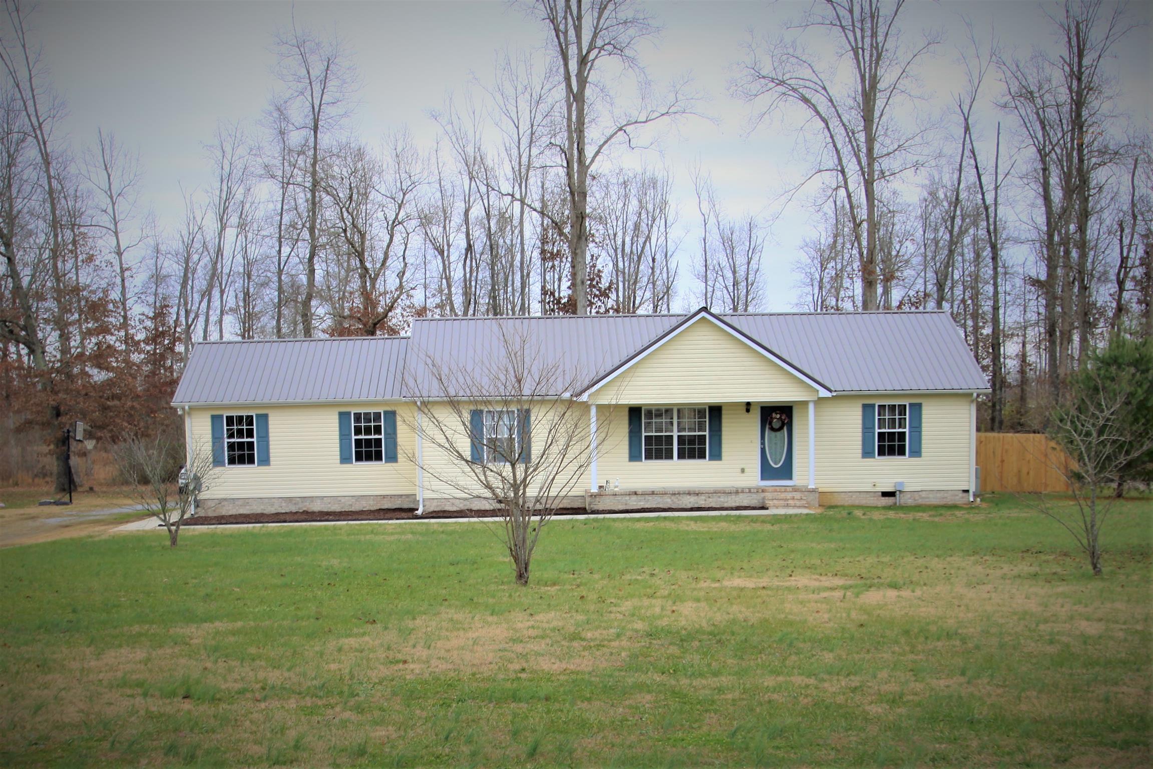 140 Ferrells Loop Road Manchester, TN 37355 - Photo 1 of 17 a front view of a house with a yard