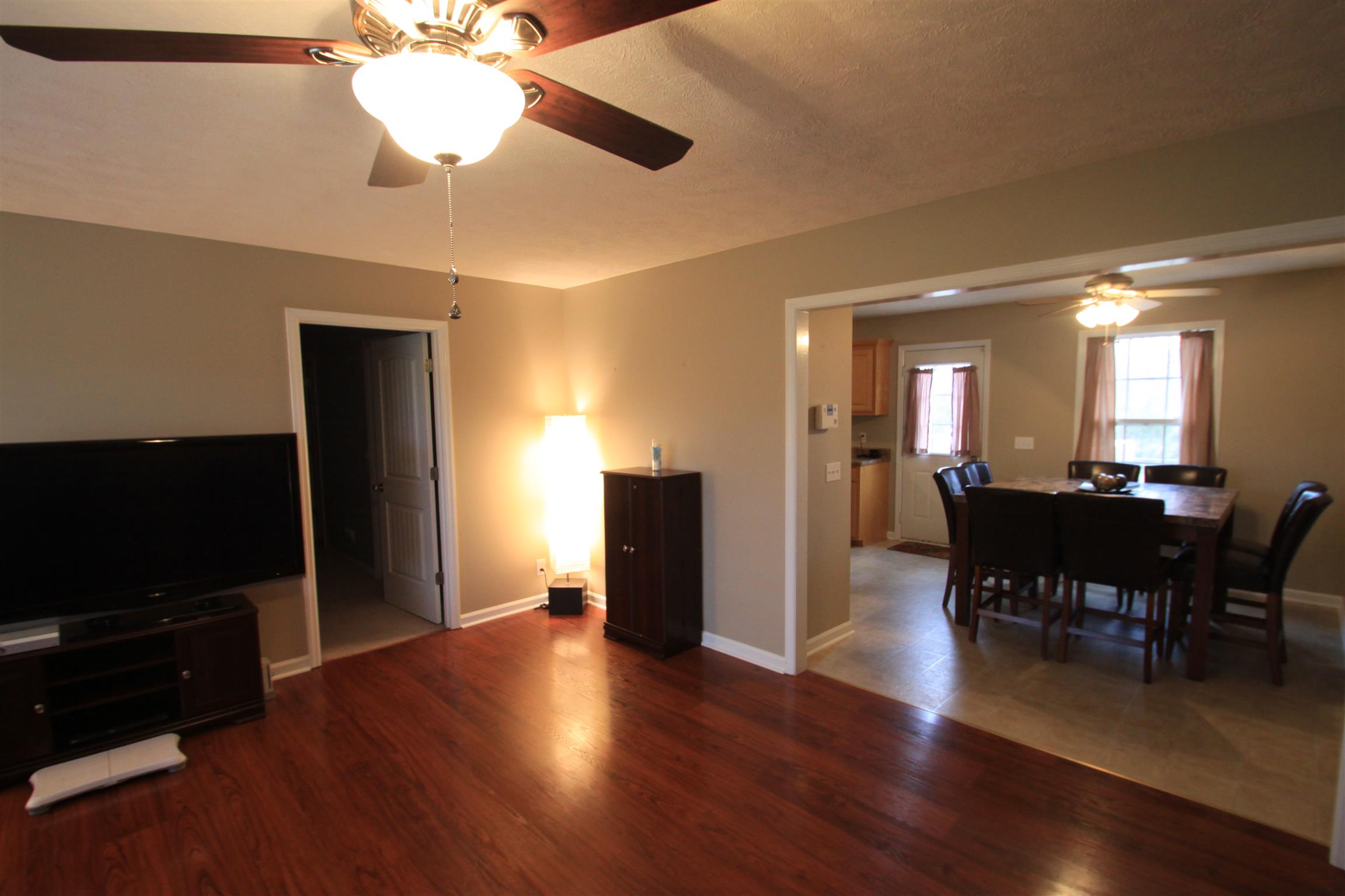 140 Ferrells Loop Road Manchester, TN 37355 - Photo 3 of 17 a view of a dining room with furniture wooden floor and chandelier