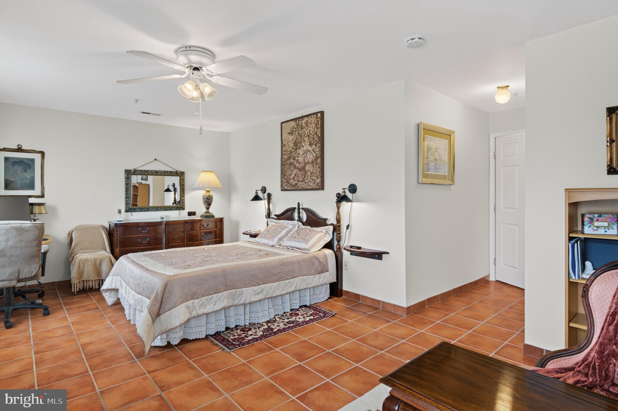 936 Bay Ridge Avenue, Unit 201 Annapolis, MD 21403 - Photo 30 of 40 a bedroom with double bed and a chandelier