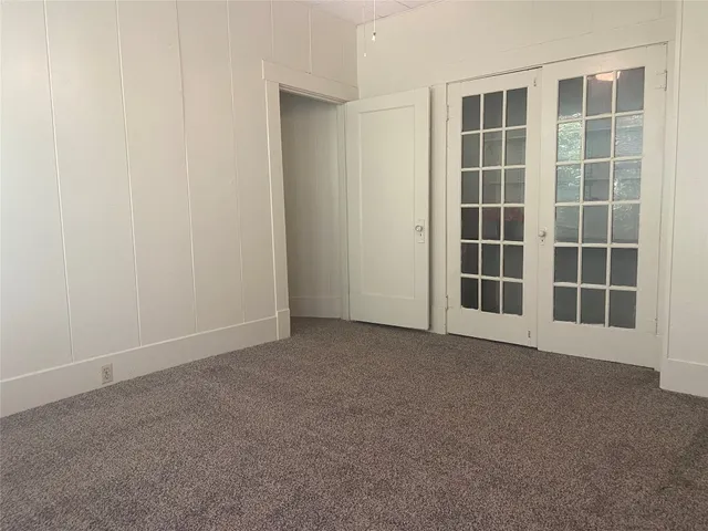 a view of empty room with windows