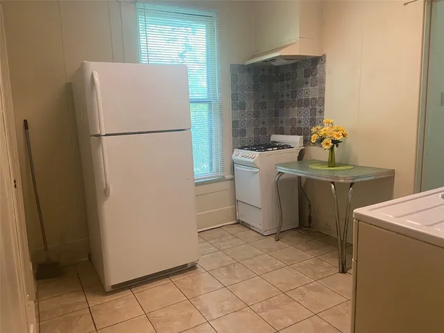 a utility room with cabinets washer and dryer