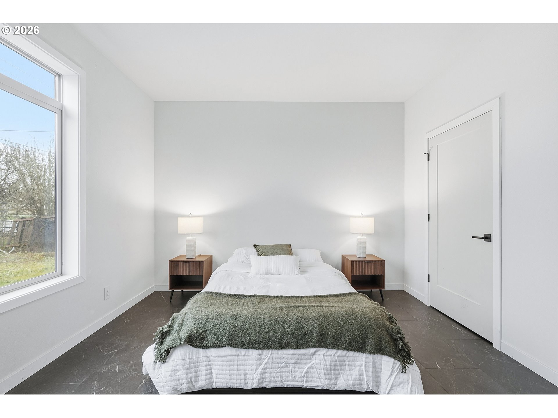 21280 Southwest Baseline Road Beaverton, OR 97003 - Photo 15 of 45 a bedroom with a bed and a night stand