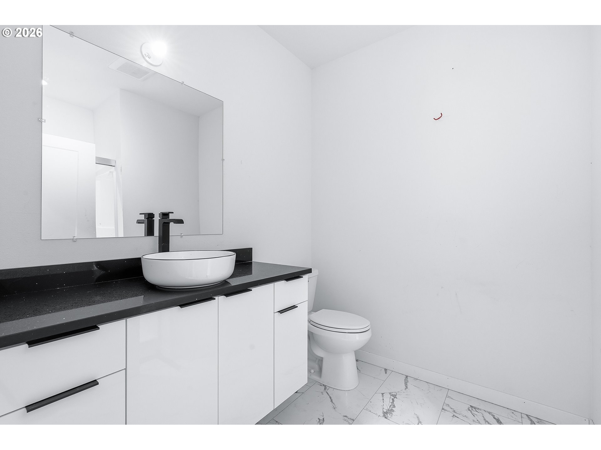 21280 Southwest Baseline Road Beaverton, OR 97003 - Photo 24 of 45 a bathroom with a sink toilet and a mirror