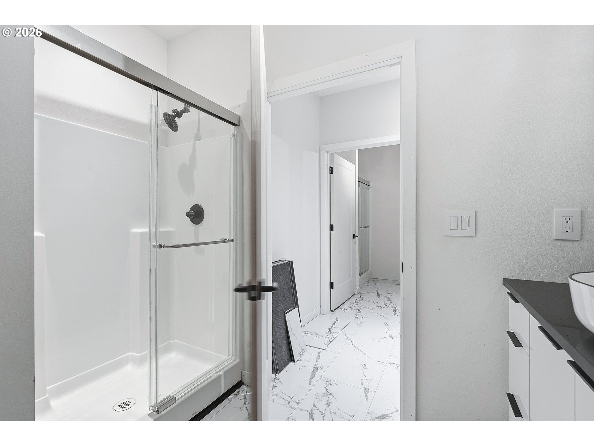 21280 Southwest Baseline Road Beaverton, OR 97003 - Photo 25 of 45 a bathroom with a glass shower door