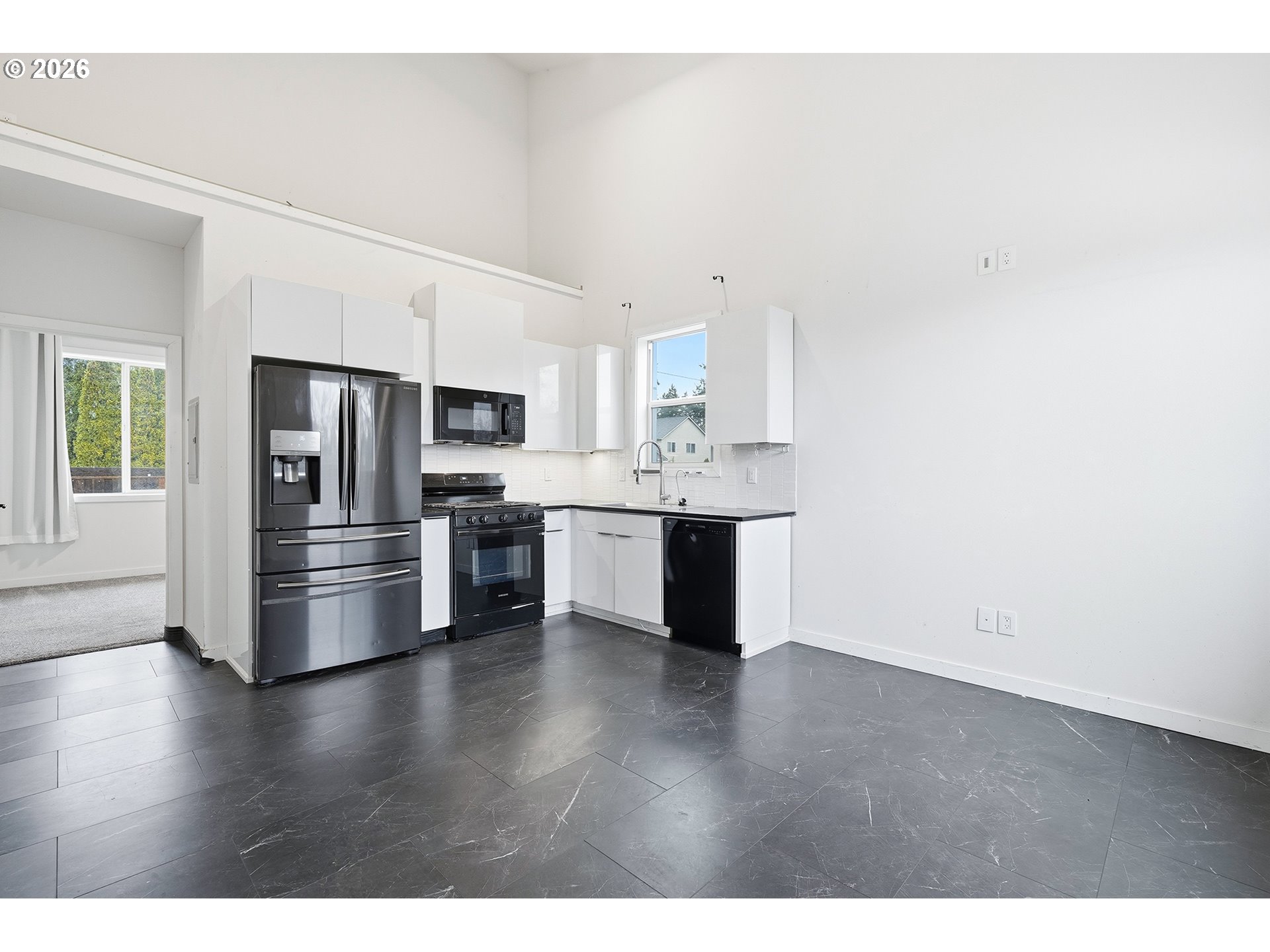 21280 Southwest Baseline Road Beaverton, OR 97003 - Photo 30 of 45 a kitchen with stainless steel appliances a refrigerator and a stove top oven
