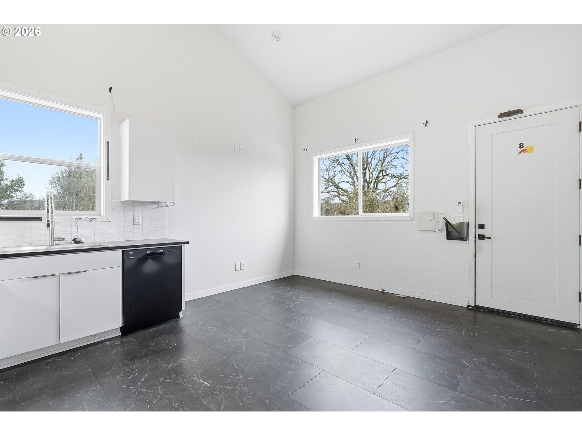 21280 Southwest Baseline Road Beaverton, OR 97003 - Photo 31 of 45 a kitchen with a refrigerator and white cabinets