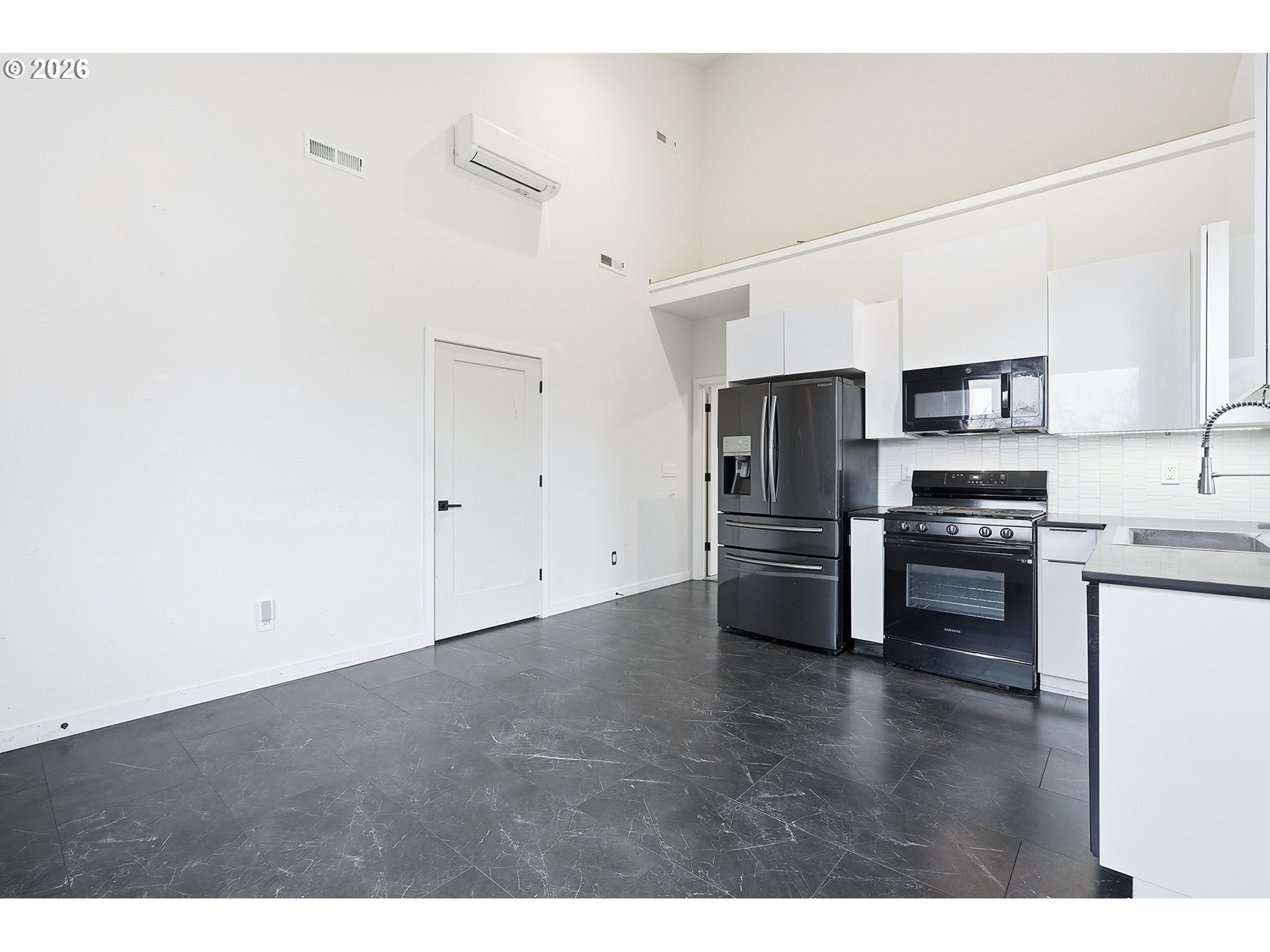 21280 Southwest Baseline Road Beaverton, OR 97003 - Photo 32 of 45 a kitchen with stainless steel appliances a refrigerator and a stove top oven