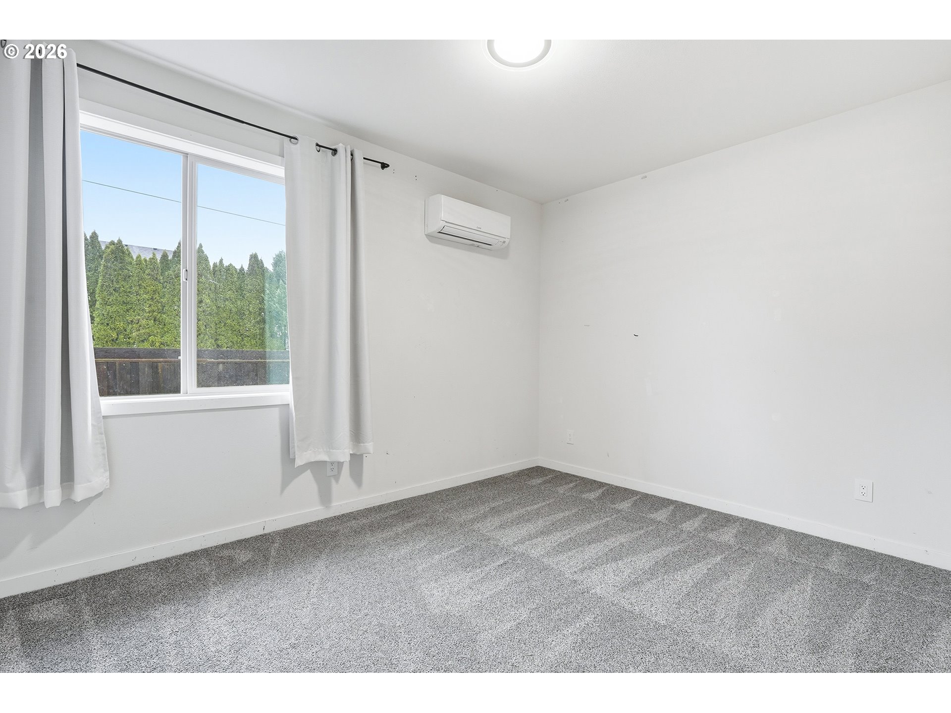 21280 Southwest Baseline Road Beaverton, OR 97003 - Photo 33 of 45 a view of an empty room with a window