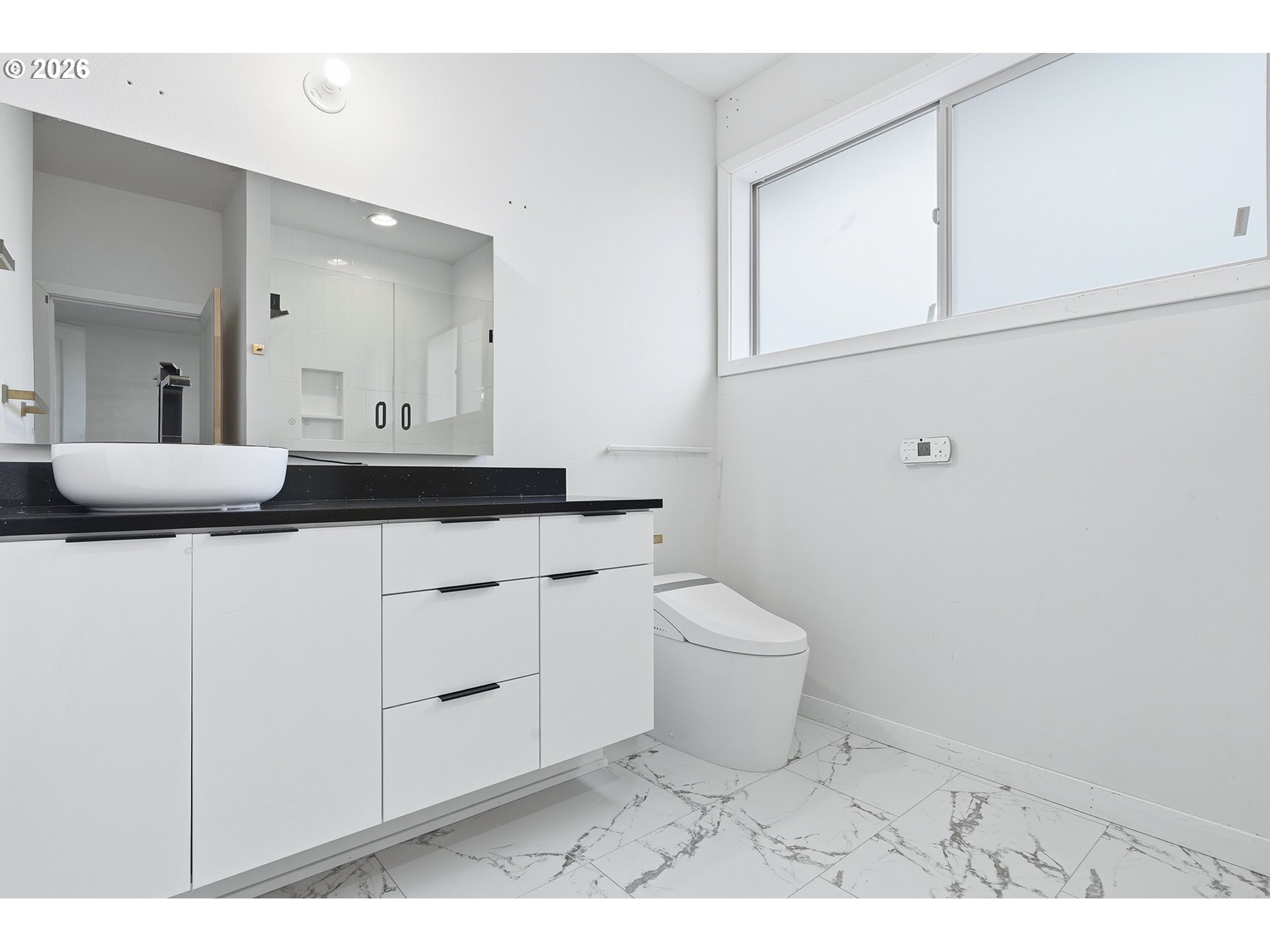 21280 Southwest Baseline Road Beaverton, OR 97003 - Photo 35 of 45 a bathroom with a sink a toilet and mirror
