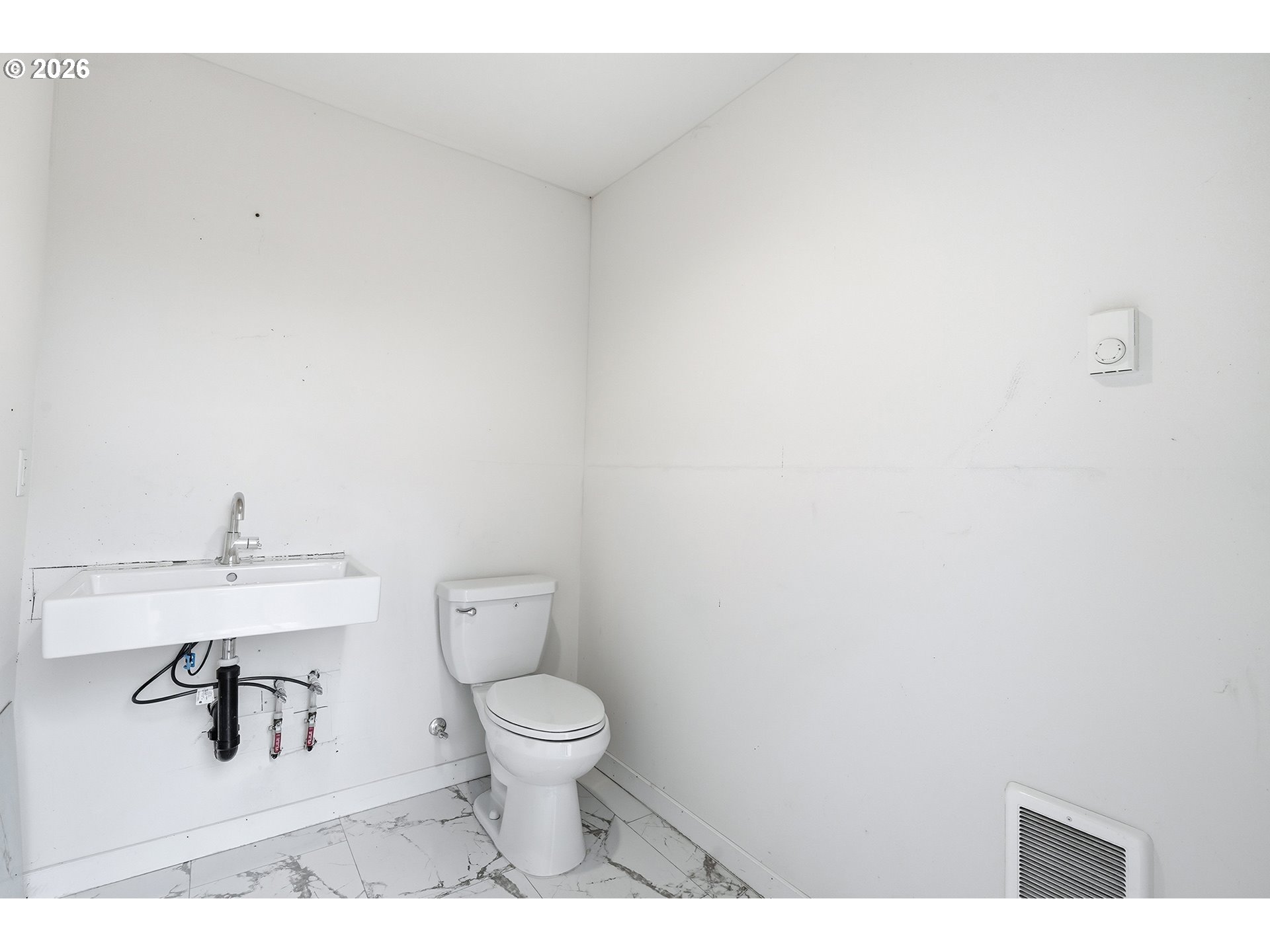 21280 Southwest Baseline Road Beaverton, OR 97003 - Photo 39 of 45 a bathroom with a toilet and a sink