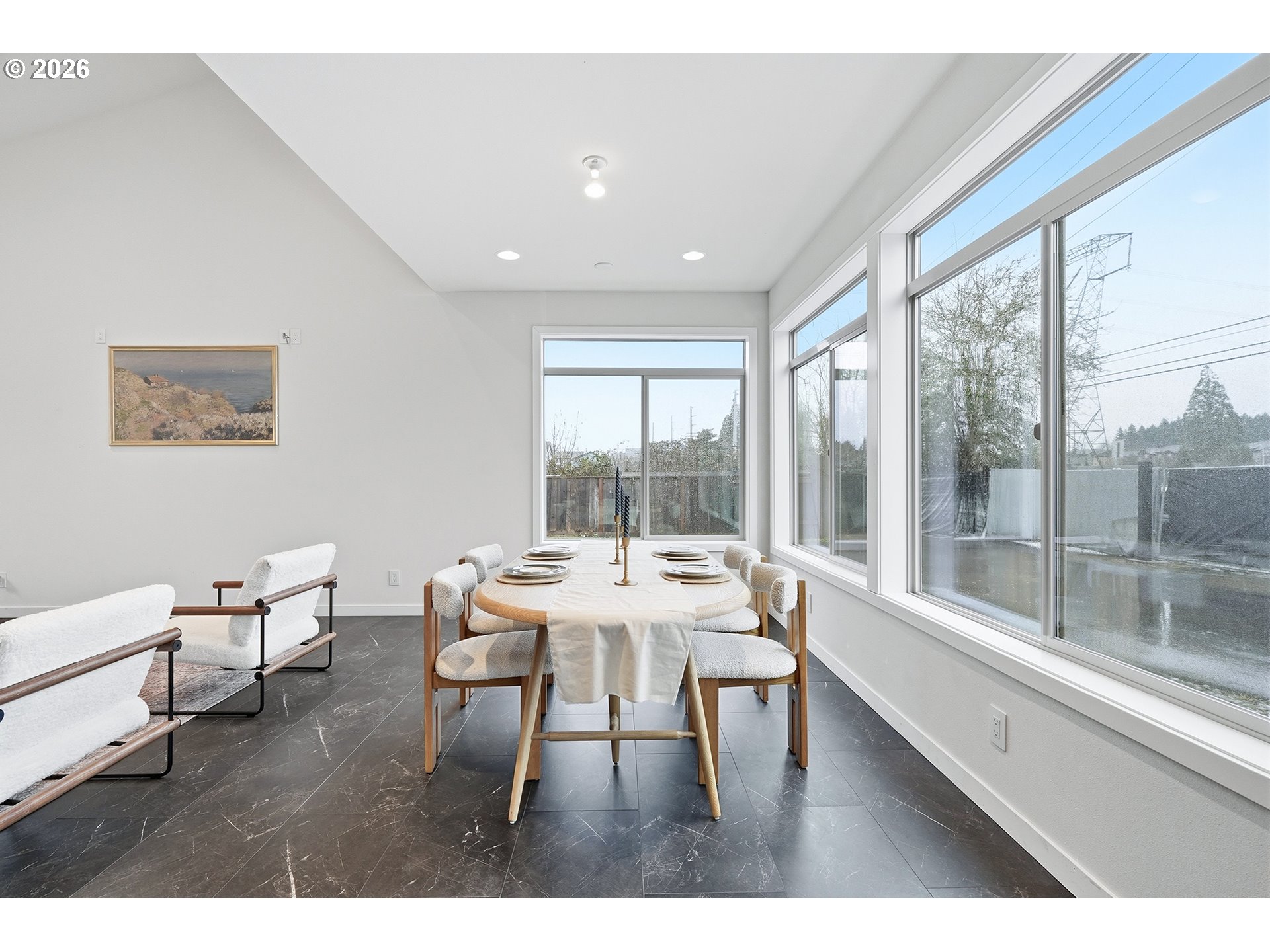 21280 Southwest Baseline Road Beaverton, OR 97003 - Photo 5 of 45 a dining room with wooden floor and a floor to ceiling window