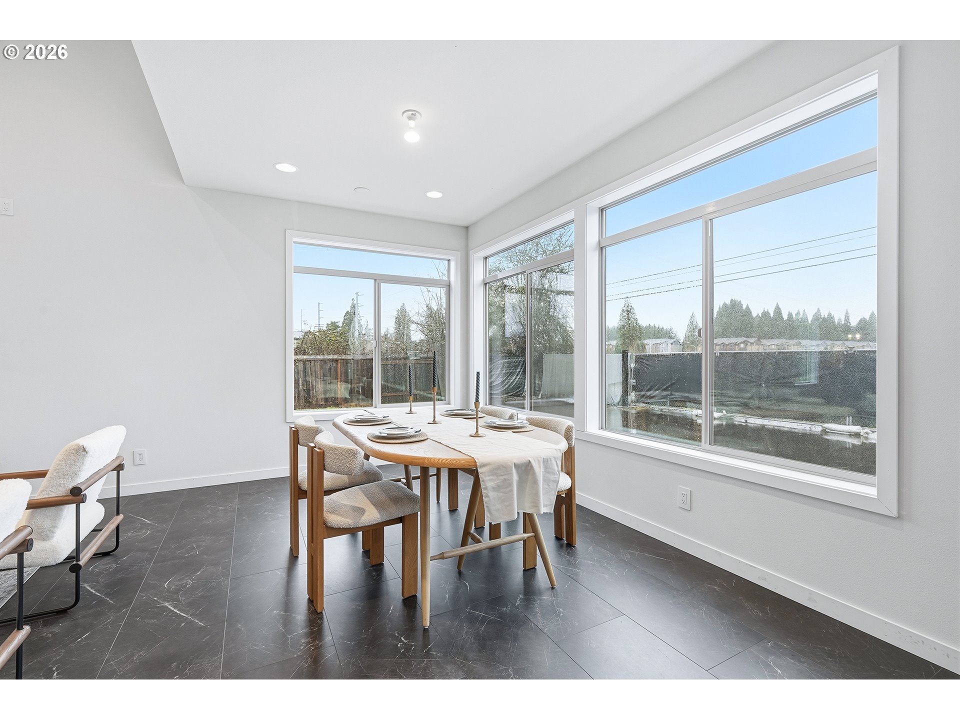 21280 Southwest Baseline Road Beaverton, OR 97003 - Photo 6 of 45 a dining room with furniture wooden floor and a rug