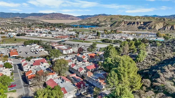 a view of a city with mountains in the background