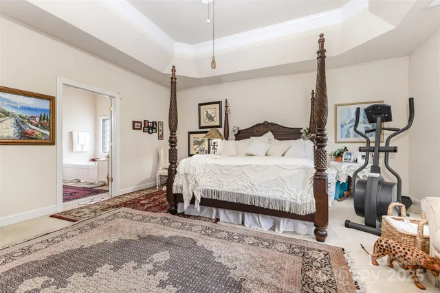 a bedroom with a bed window and walk in closet
