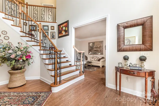 a living room with furniture and flowers