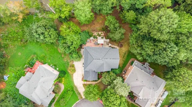 an aerial view of a house with outdoor space and street view