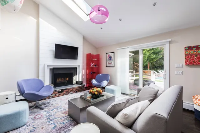 a living room with furniture or couch and a fireplace