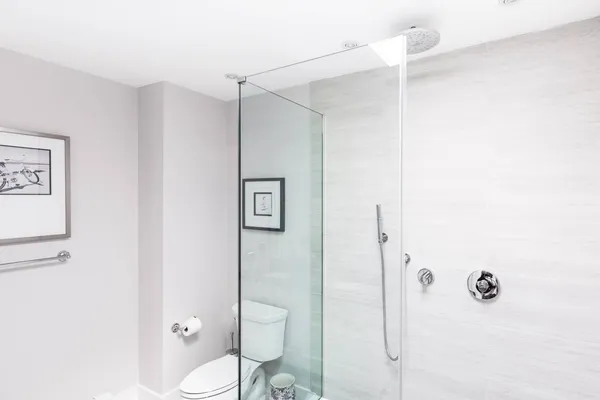 a bathroom with a toilet and a shower